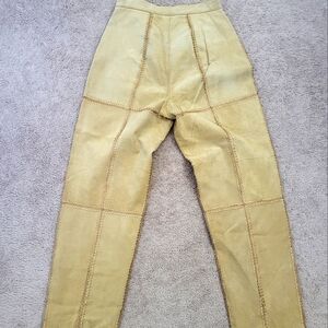 A two piece suede and crochet pant suit